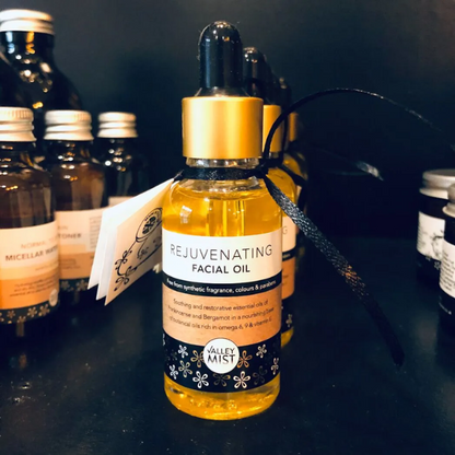 Valley Mist rejuvenating facial oil bottle, natural skincare product for glowing skin, with dropper applicator on a neutral background