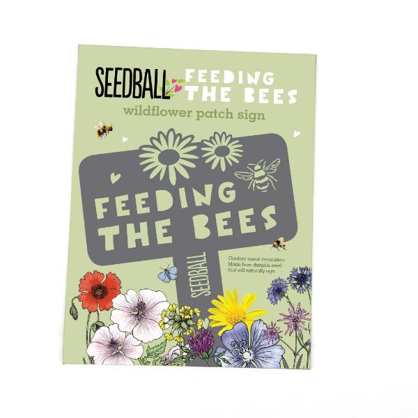 "Feeding the Bees" stainless steel sign by Seedball in cardboard packaging