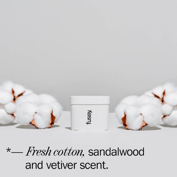 Fussy deodorant refill with cotton on a light grey background and text reading "Fresh cotton, sandalwood and vetiver scent'