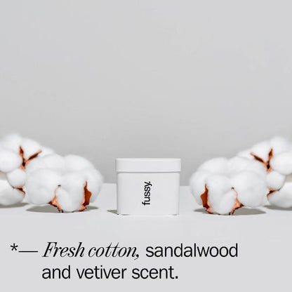 Fussy deodorant refill with cotton on a light grey background and text reading "Fresh cotton, sandalwood and vetiver scent'