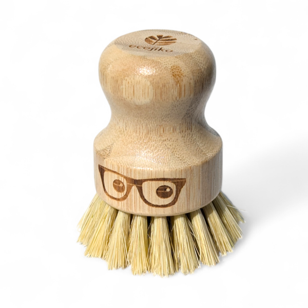 Wooden 'geeky' pot brush with a spectacled face design on a white background