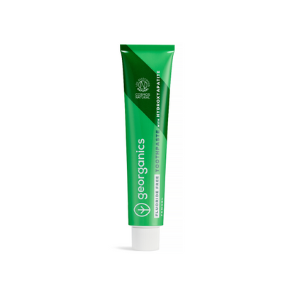 Green tube of Georganics fluoride-free fennel toothpaste on a white background