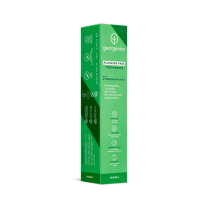 Green cardboard box containing Georganics fluoride-free fennel toothpaste on a white background