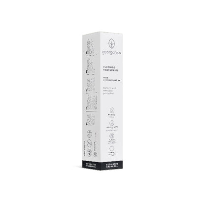 White box of Georganics toothpaste activated charcoal on a white background
