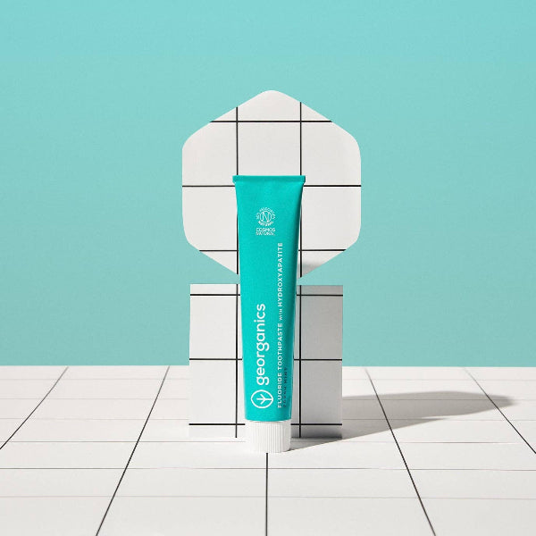 Georganics fluoride toothpaste with hydroxyapatite for fresh mint flavor, showing the toothpaste tube on a white background.