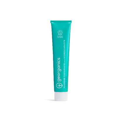 Georganics fluoride toothpaste with hydroxyapatite and fresh mint flavor for natural oral care and cavity protection.