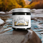 Valley Mist hair styling mud in glass jar with metal lid with a river in the background