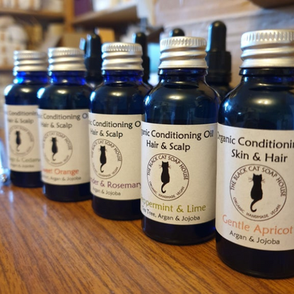 Organic conditioning oil for hair, scalp and face, several bottles in different fragrances with aluminium lid