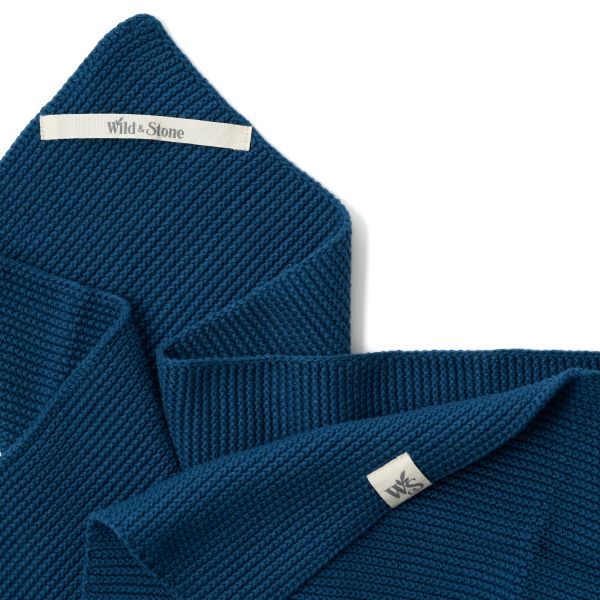 Knitted cotton hand towel in Ocean blue shown close up