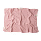 Knitted cotton hand towel in Rose pink shown unfolded