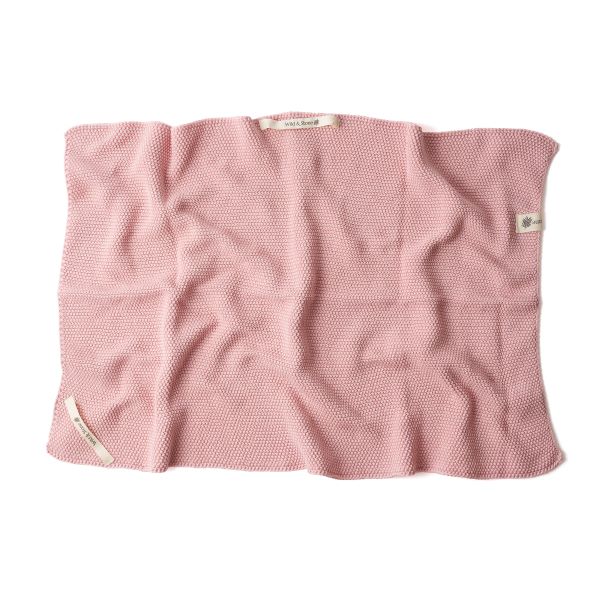 Knitted cotton hand towel in Rose pink shown unfolded