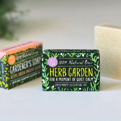 Paper Plane Herb Garden Rosemary Soap bar with fresh rosemary herbs visible, natural skincare product.