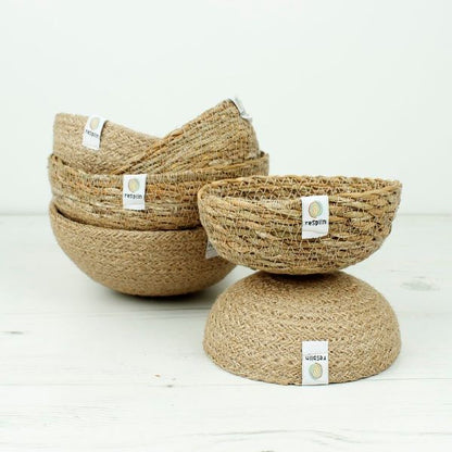 Natural jute and seagrass bowls by ReSpiin, showcasing eco-friendly home accessories with woven textured surfaces.