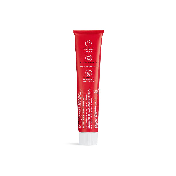 Kids hydroxyapatite toothpaste with fluoride in red aluminium tube shown from back