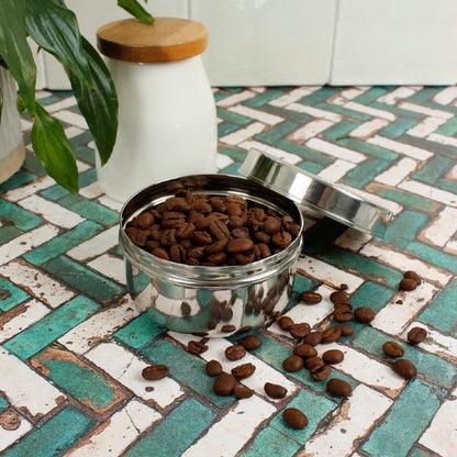 Stainless steel mini food container with lid shown off and coffee inside