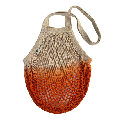 Orange dip-dyed organic cotton string bag with long handles, ideal for groceries or shopping from Turtle Bags.