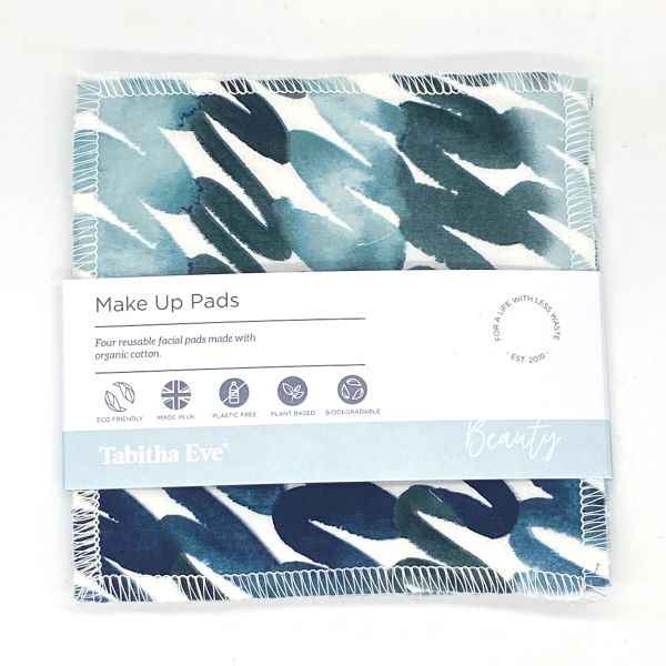 Reusable make up pad in Teal swirl design  (white background with different shades of teal and blue swirling), shown with paper label reading 'Make Up pads, Four reusable facial pads made with organic cotton' 