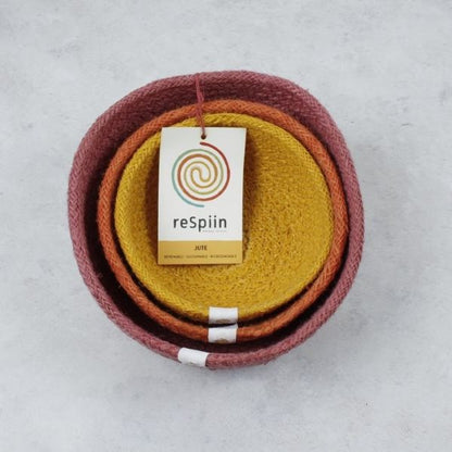 Set of three mini jute bowls in Fire colour (bright pink, orange and yellow)  stacked inside each other