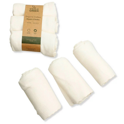 Organic cotton set of three muslin cloths, shown both as the set with paper wrapper, and as three separate cloths rolled up.  All pale cream coloured.