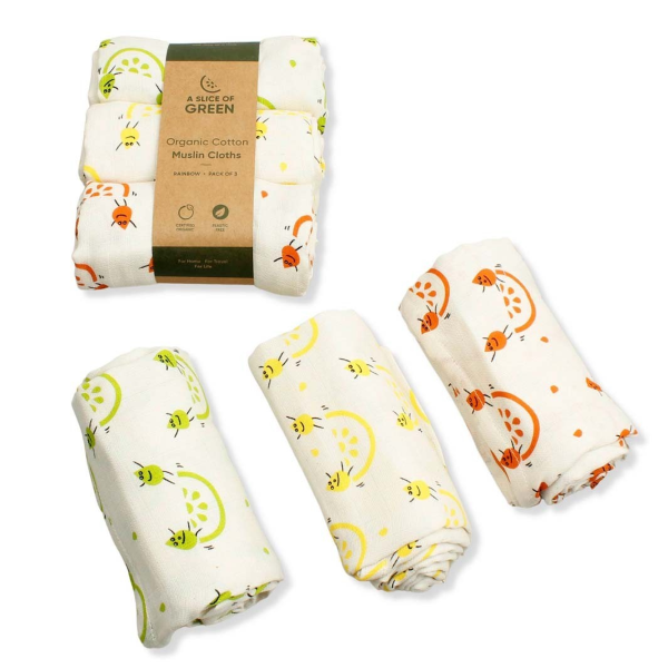 Organic cotton set of three muslin cloths, shown both as the set with paper wrapper, and as three separate cloths rolled up.  All with cream background with colourful fruity images.