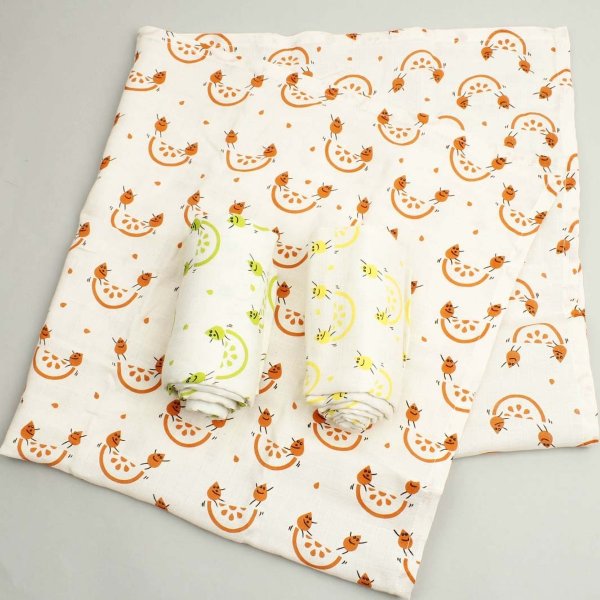 Organic cotton set of three muslin cloths, one shown opened out and the other two rolled up. All with cream background then colourful fruity images 