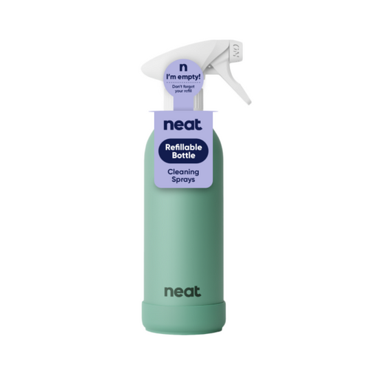 Green aluminium refillable spray bottle with 'neat' branding on a white background