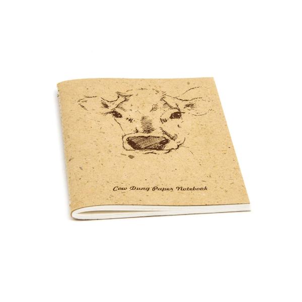 Notebook made from cow dung paper with a cow illustration on a beige background