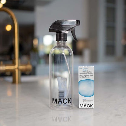 Ocean potion multi-surface cleaner dissolvable cleaning pod in cardboard packaging shown next to spray bottle with pod inside
