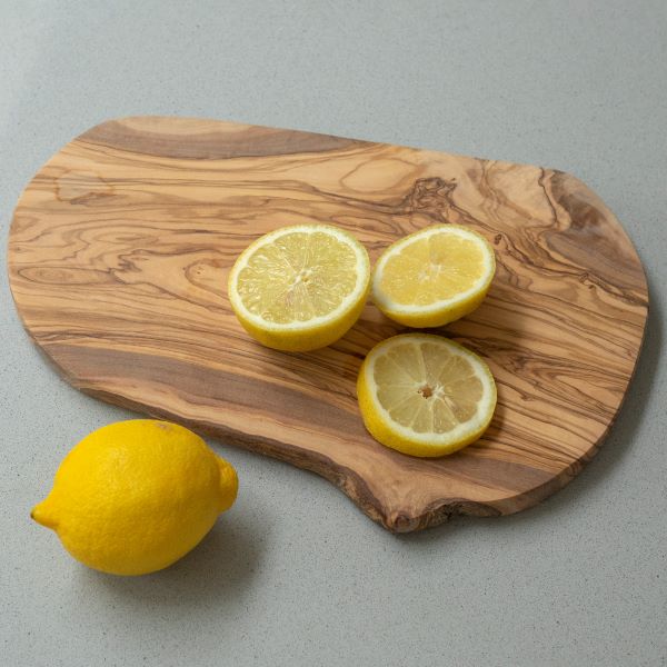 Olive wood chopping board shown with a sliced lemon