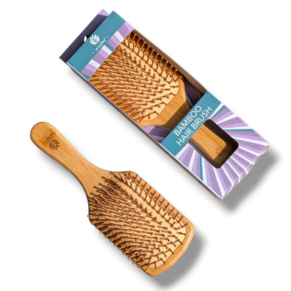 Wooden paddle hairbrush with cardboard packaging on a white background