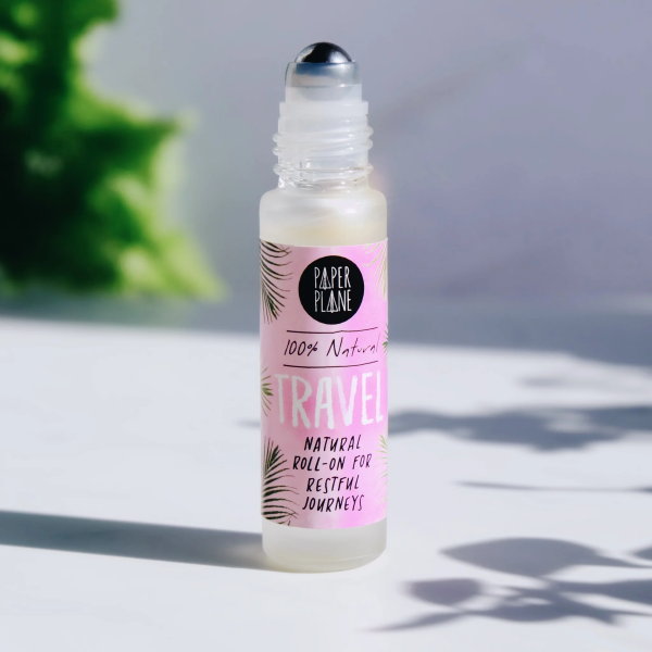 Natural pulse point roll on with lid off, with text on label reading '100% natural Travel natural roll-on for restful journeys'