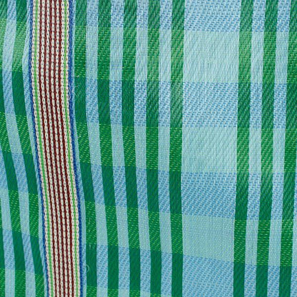 Recycled cement sack in 'Ocean' colourway (blue and green stripes) shown close up