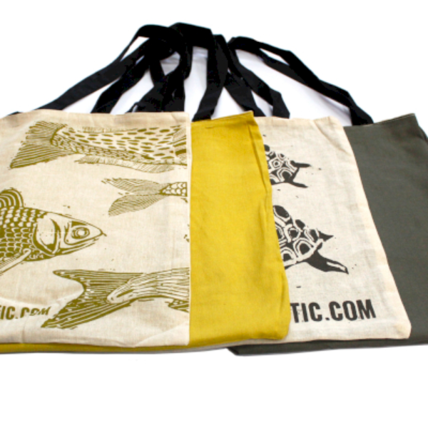 Both reversible bag designs shown with print and alternative colour background
