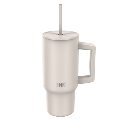SHO reusable insulated large tumbler in taupe shown with straw