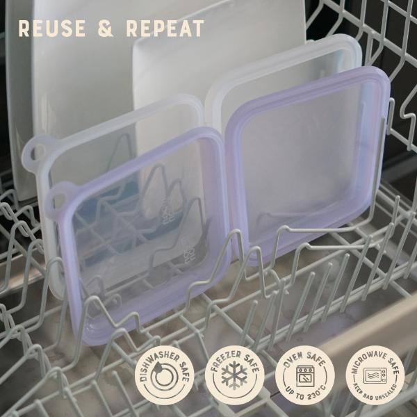 Silicone food storage containers with lids in a dishwasher with 'Reuse & Repeat' text above.
