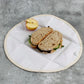Organic cotton sandwich wrapper shown open with a sandwich and an apple