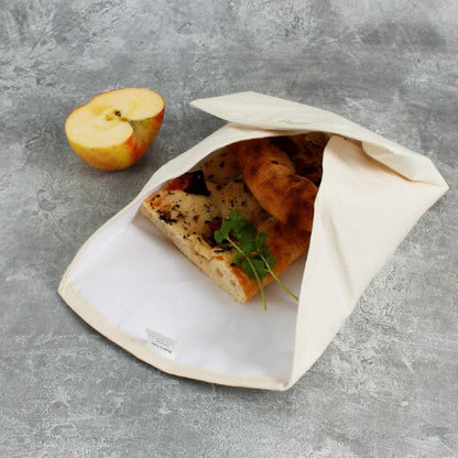 Organic cotton sandwich wrapper shown with a sandwich inside 