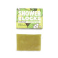 Totally solid shower gel bar in lime and sandalwood, shown alongside green cardboard packaging