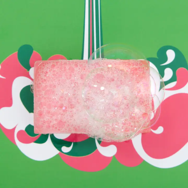 Totally solid shower gel bar in mint and grapefruit shown with lots of lather