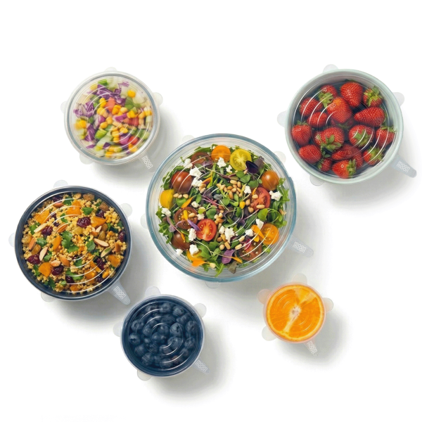 Set of salad bowls and fruit with various ingredients and different size silicone lids on a white background