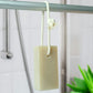 Friendly Soap soap on a rope shown hanging from a shower rail