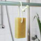 Friendly Soap soap on a rope shown hanging from a shower rail