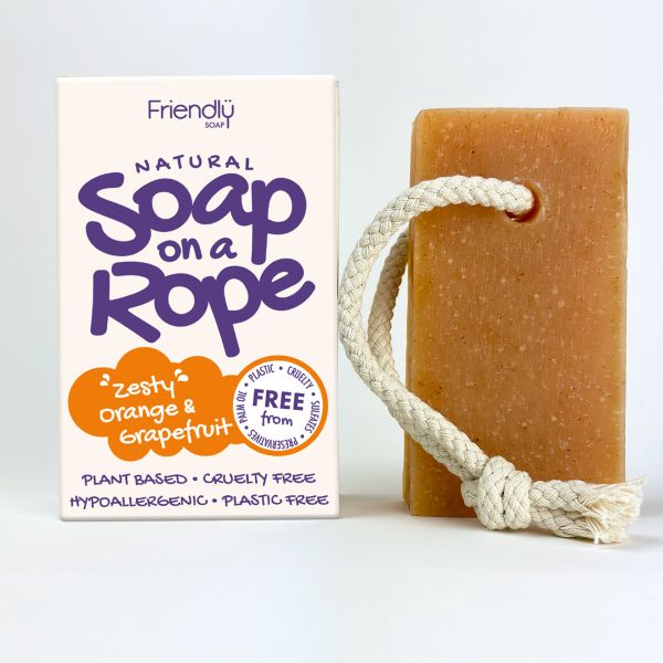 Friendly Soap soap on a rope in zesty orange and grapefruit shown alongside cardboard box