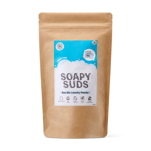 Kraft paper packaging of Soapy Suds laundry powder in Fresh Linen with a light blue label on a white background