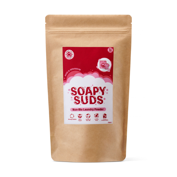 Kraft paper packaging of Soapy Suds laundry powder in Rose and Geranium with a red label on a white background
