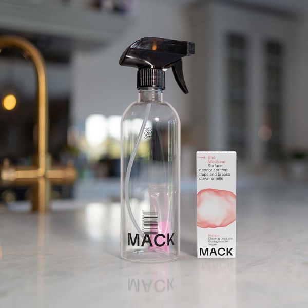 Fat buoy surface deodoriser dissolvable cleaning pod in cardboard packaging shown next to reusable bottle with pod inside