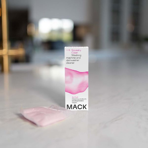 Squeaky clean washing machine and dishwasher cleaner pod inside cardboard box with pod alongside