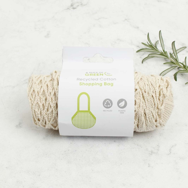 Natural coloured strong bag made with recycled cotton, with long handles, shown in paper label packaging