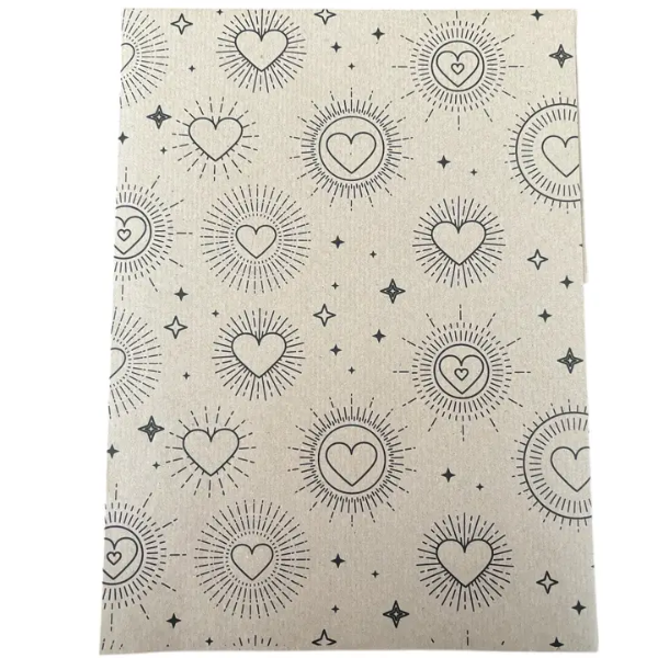 Planetwrapit eco-friendly wrapping paper with heart and sun patterns on brown kraft paper