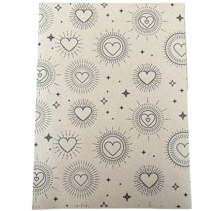 Planetwrapit eco-friendly wrapping paper with heart and sun patterns on brown kraft paper